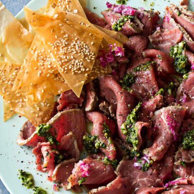 Beef carpaccio with coriander, chilli and lime pesto and phyllo sesame chips