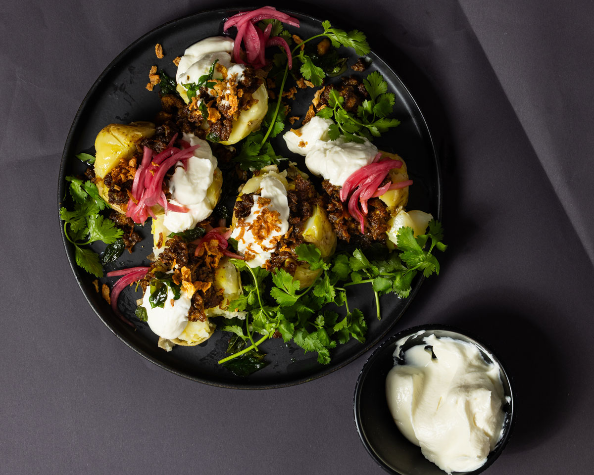 Mince curry-stuffed jacket potatoes