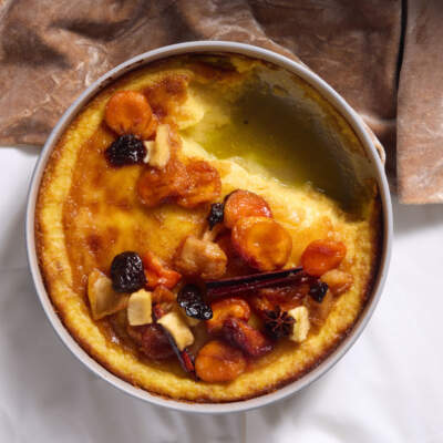 Potato pudding with stewed fruit