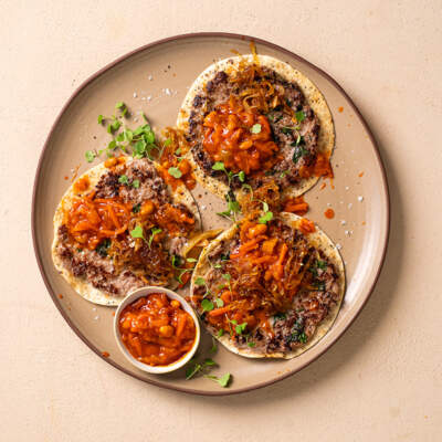 Smashed boerie taco with caramelised onions